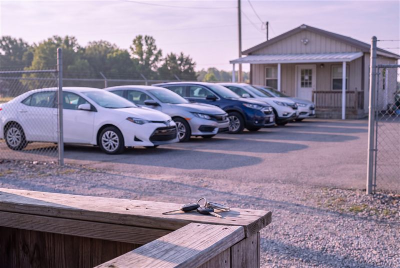 Row of rental cars at sunrise